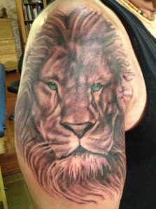 Black and grey lion tattoo , lion tattoo , realistic lion tattoo