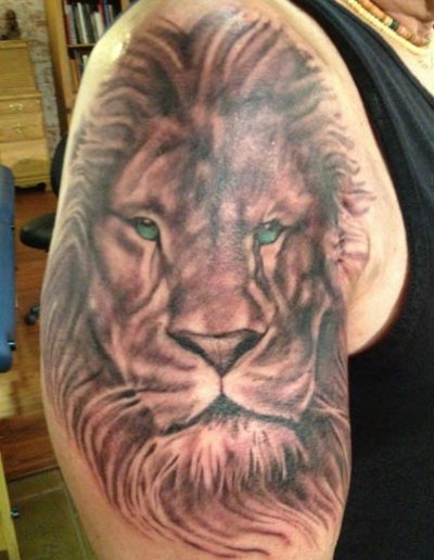 Black and grey lion tattoo , lion tattoo , realistic lion tattoo