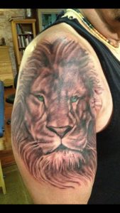 Black and grey lion tattoo , lion tattoo , realistic lion tattoo