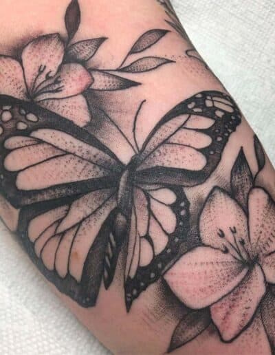 flowers and butterflies tattoo , black and grey , statue tattoo , St Augustine tattoo artist